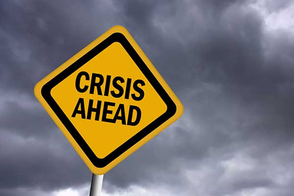 Image of "crisis ahead" yellow yield sign on Professional Psychological Services website